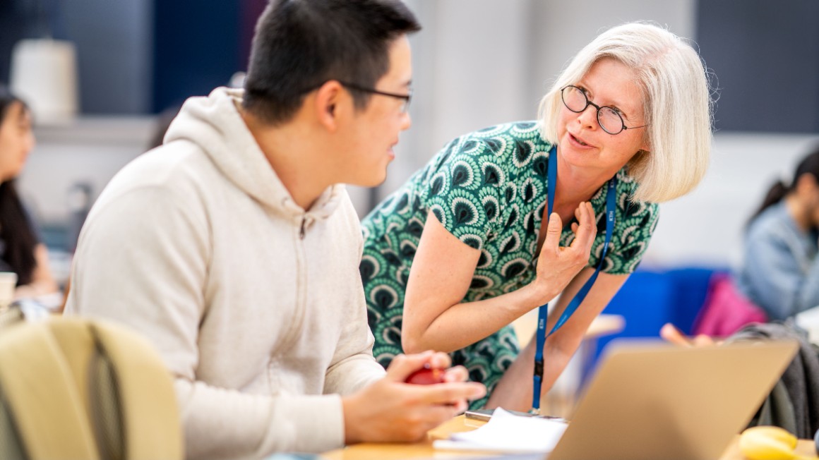 A woman and a student talking