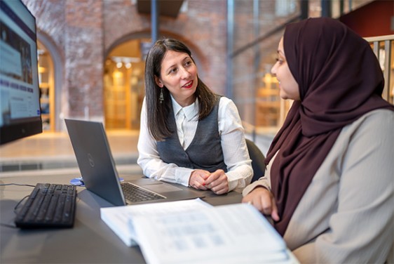 A teacher talking to a student.