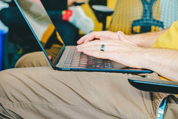 A person with a laptop in their lap