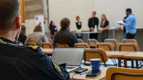 People listening to speakers
