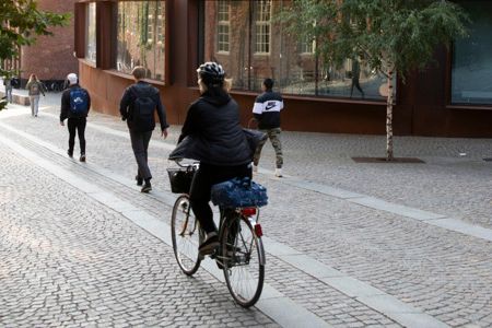 A person riding a bike on KTH Campus