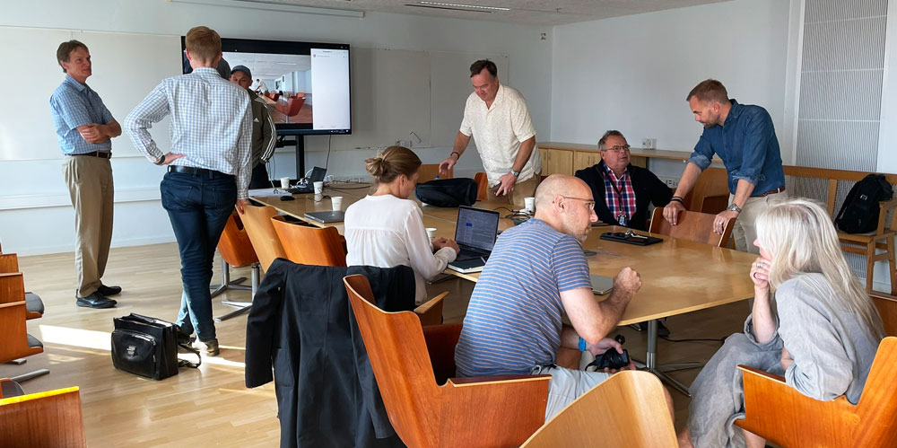 Conference room with people.