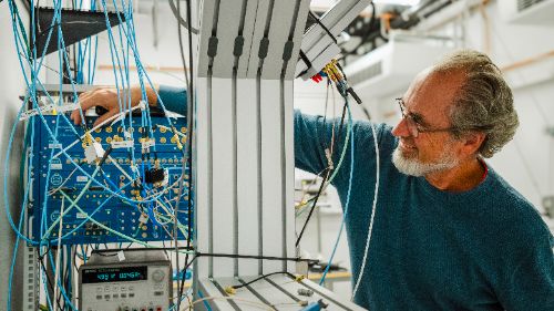 Man with device and cables.