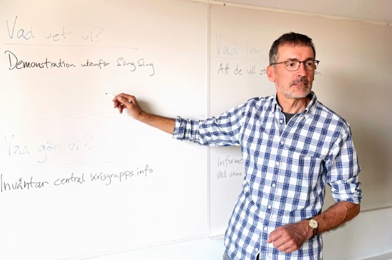 A man at a white board