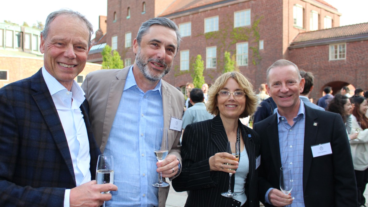 four people drinking champagne