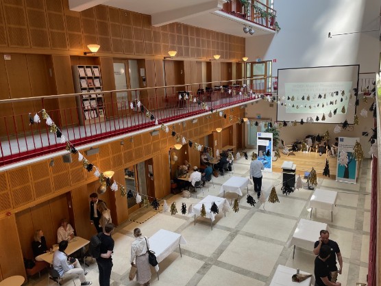 A hall with flags and tables.