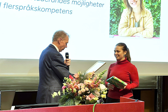 Woman receiving award
