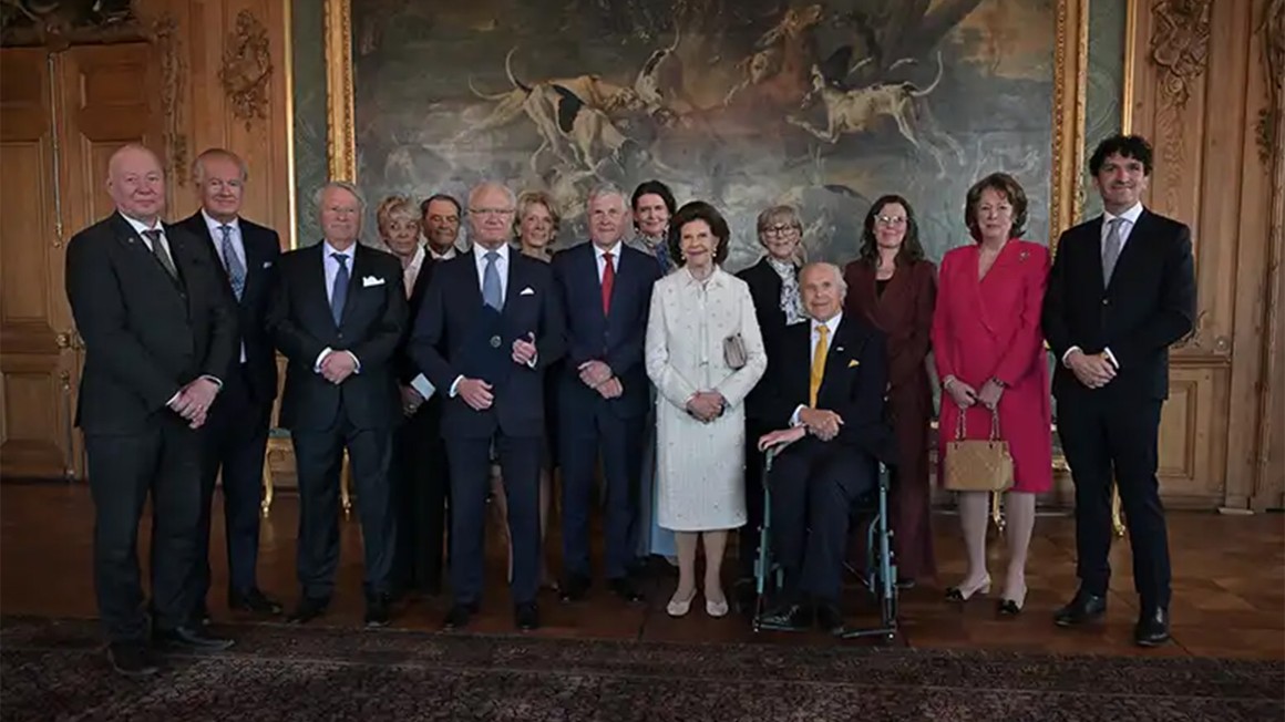 People in front of a painting.