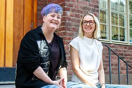 two women in a black and white t-shirt respectively