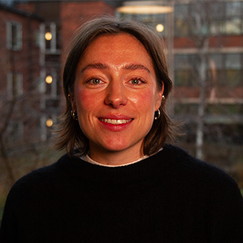 A woman in a dark sweater