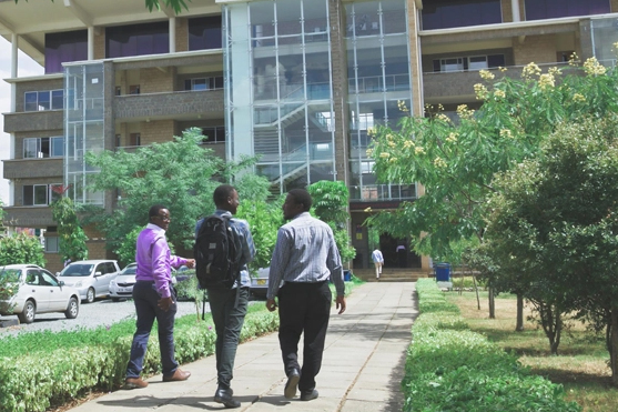 Three people outside Strathmore University Kenya